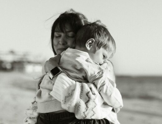 mother comforting clingy toddler