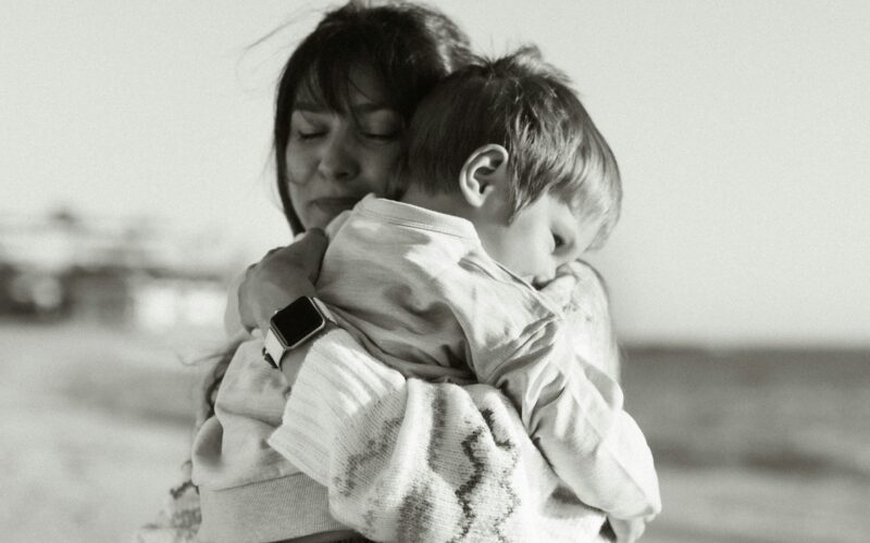 mother comforting clingy toddler